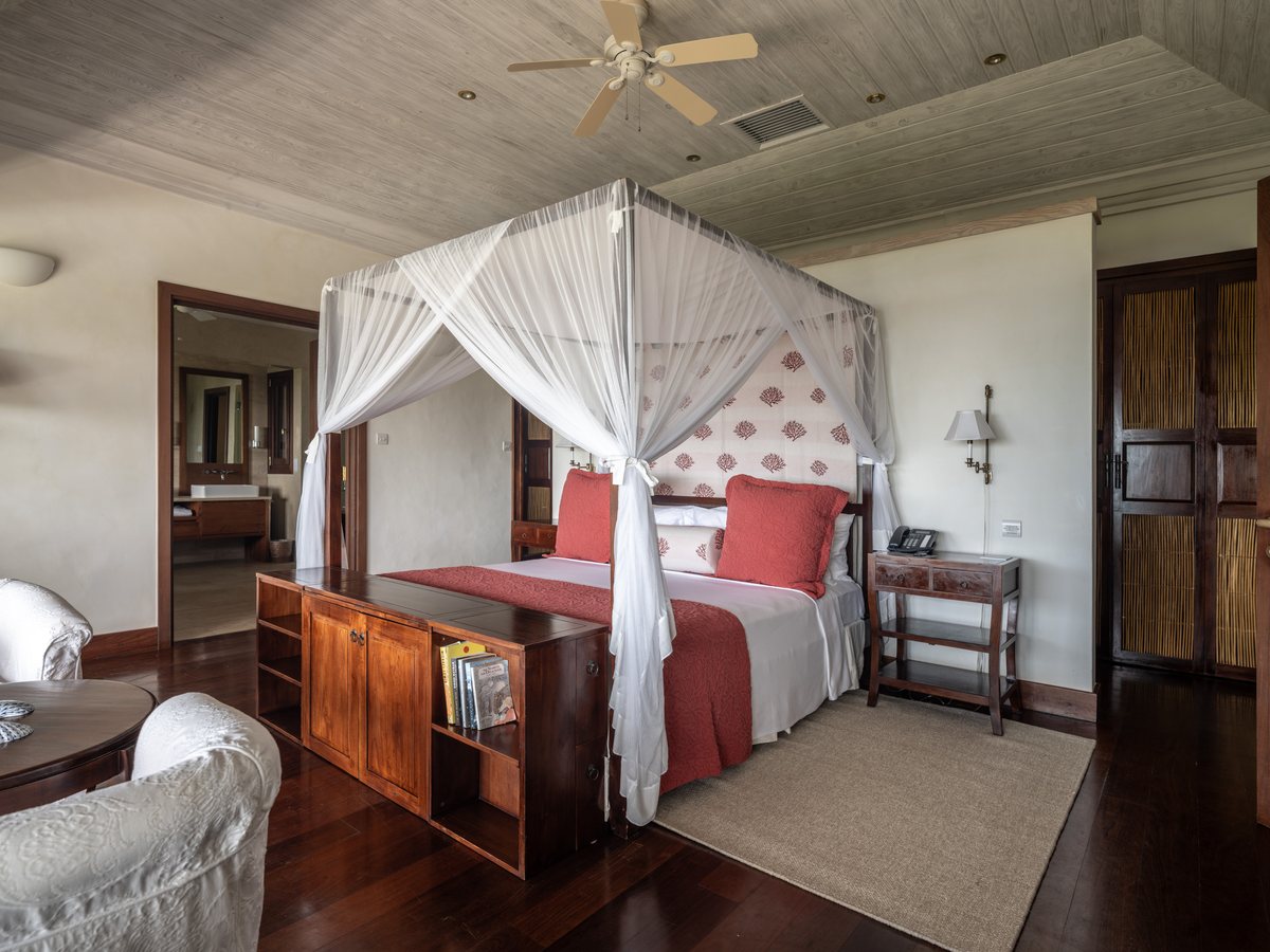 Big Blue Ocean, a bedroom with a four-poster bed