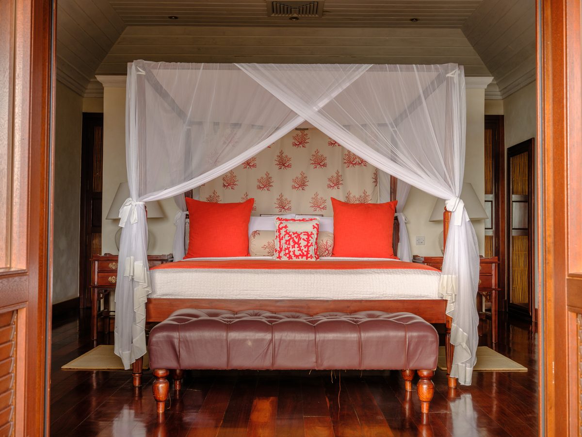 Beach House, a bedroom with a four-poster bed