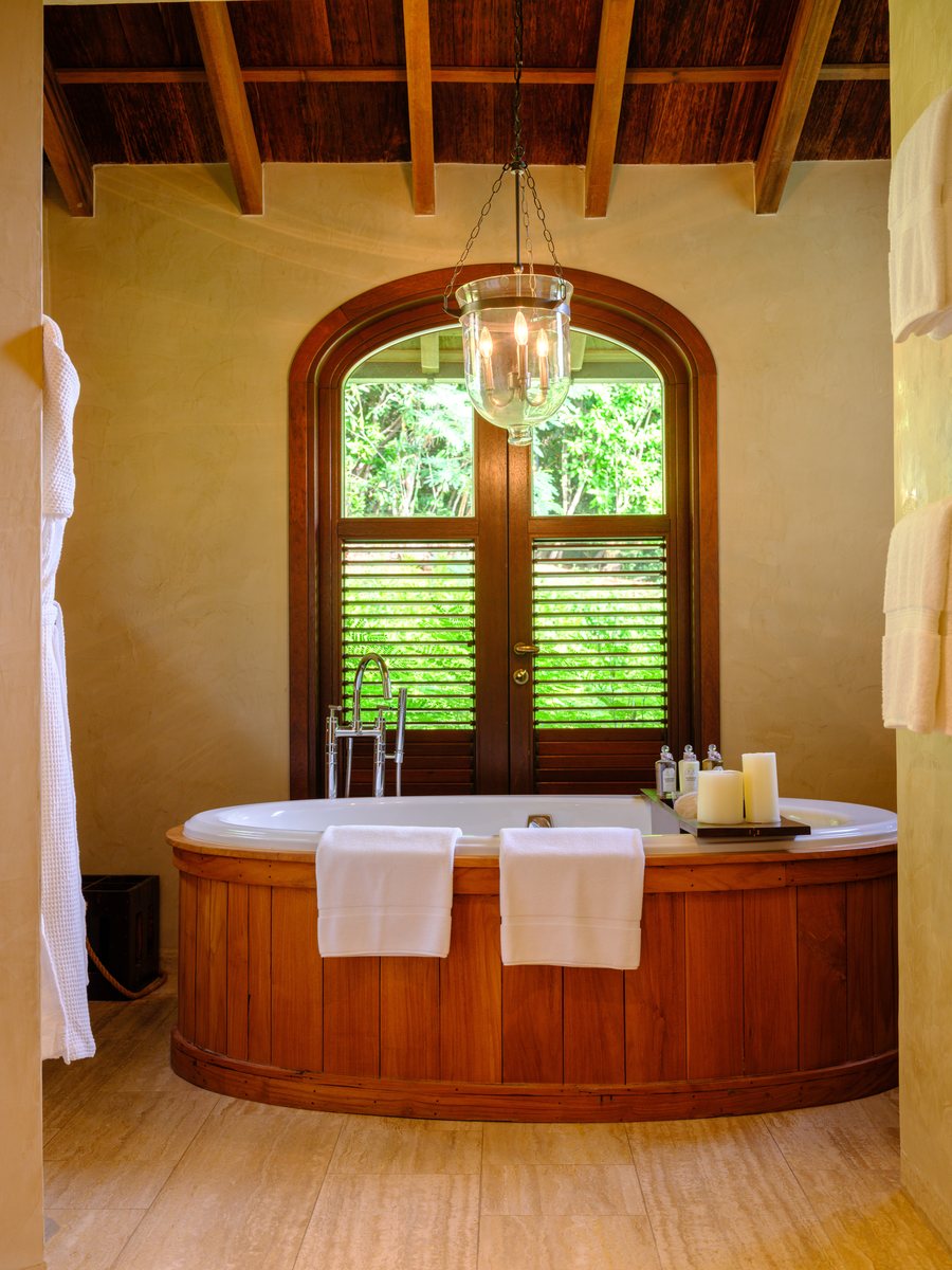 Beach House, a bathroom with a round bath