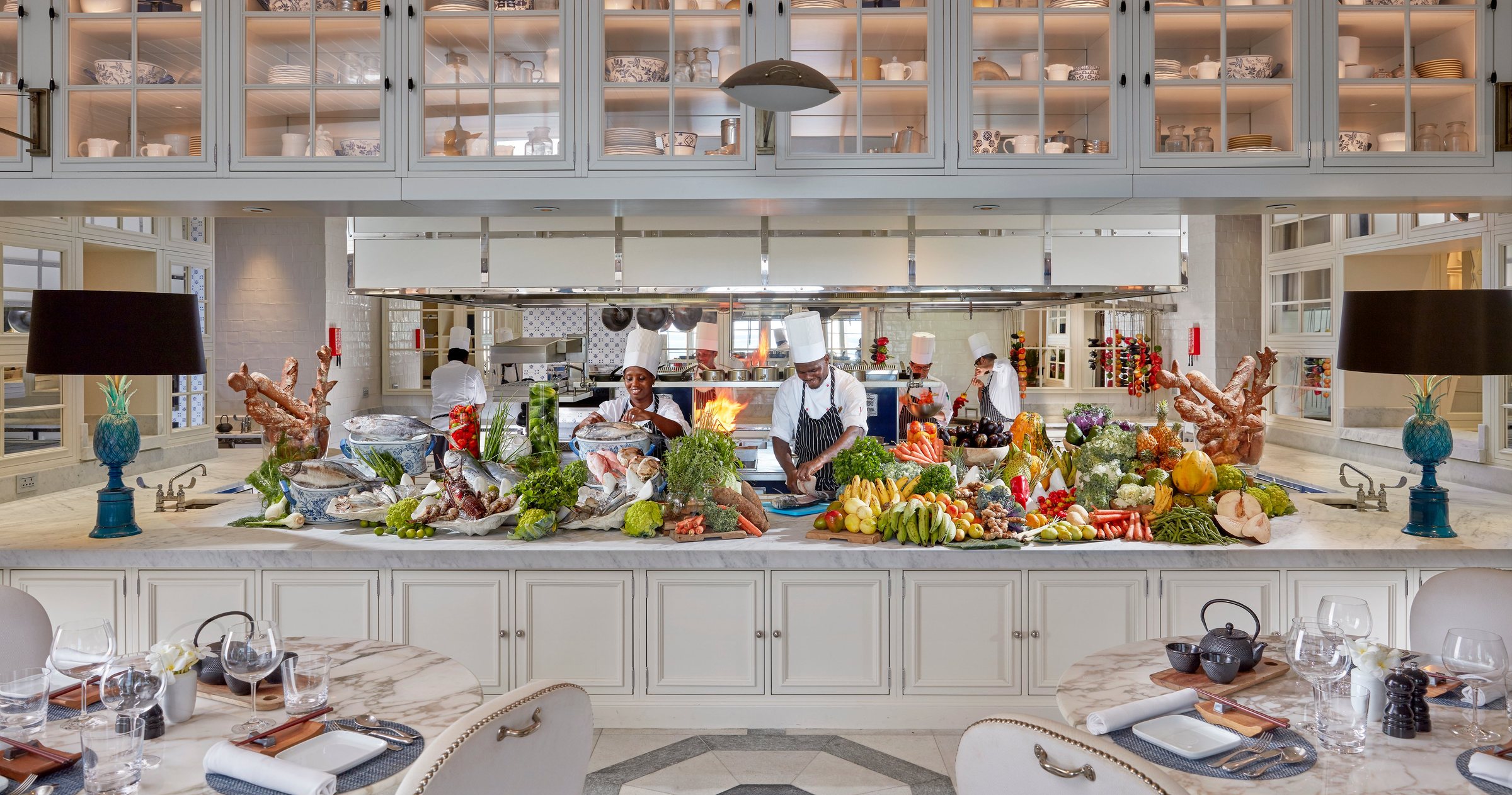 The open kitchen at Mandarin Oriental, Canouan, with the day's fish, fruit and vegetables