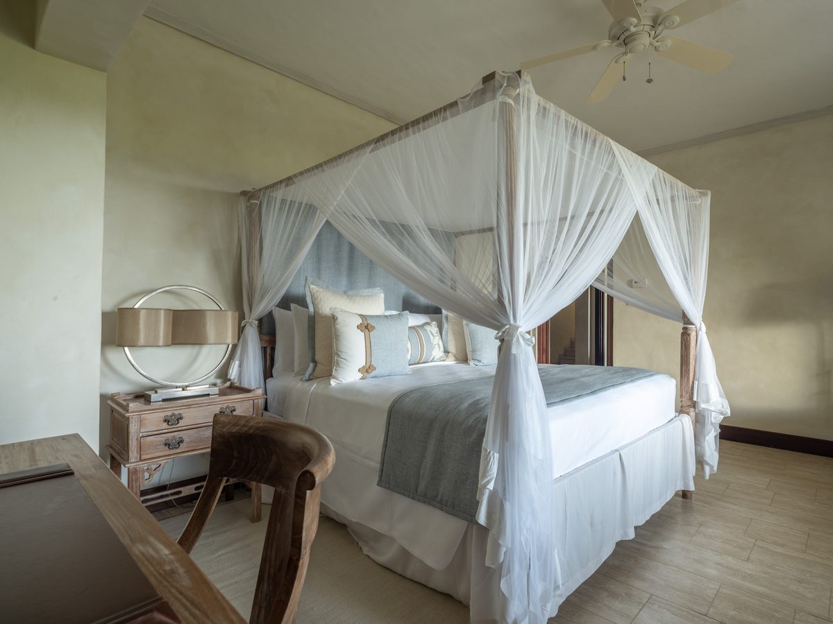 Little Blue Ocean, a bedroom with a four-poster bed