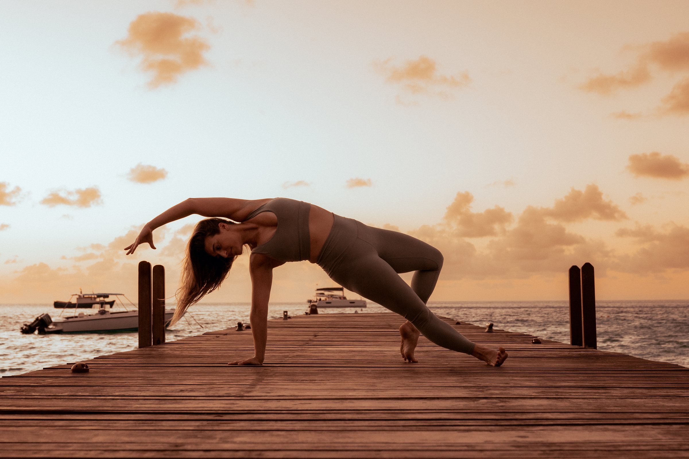 Yoga at sunset on the jetty at Soho Beach House