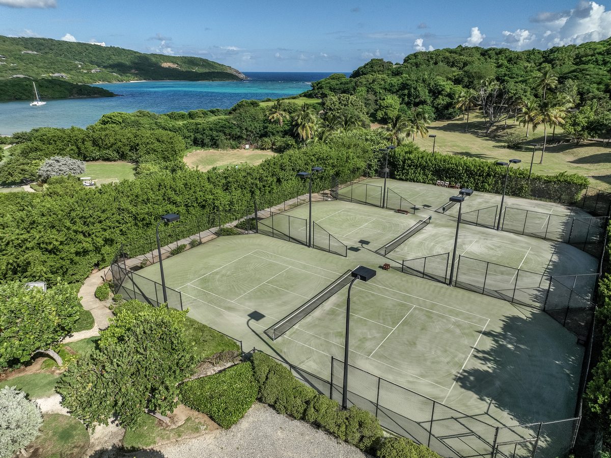 The courts from the air, with the bay beyond